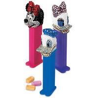 Bejeweled Minnie, Daisy and Donald PEZ® dispensers wait around for Mickey.